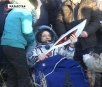 Sochi Olympic torch returns to Earth after spacewalk