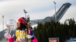 Bjoergen wins 5th Holmenkollen 30 km to end World Cup season